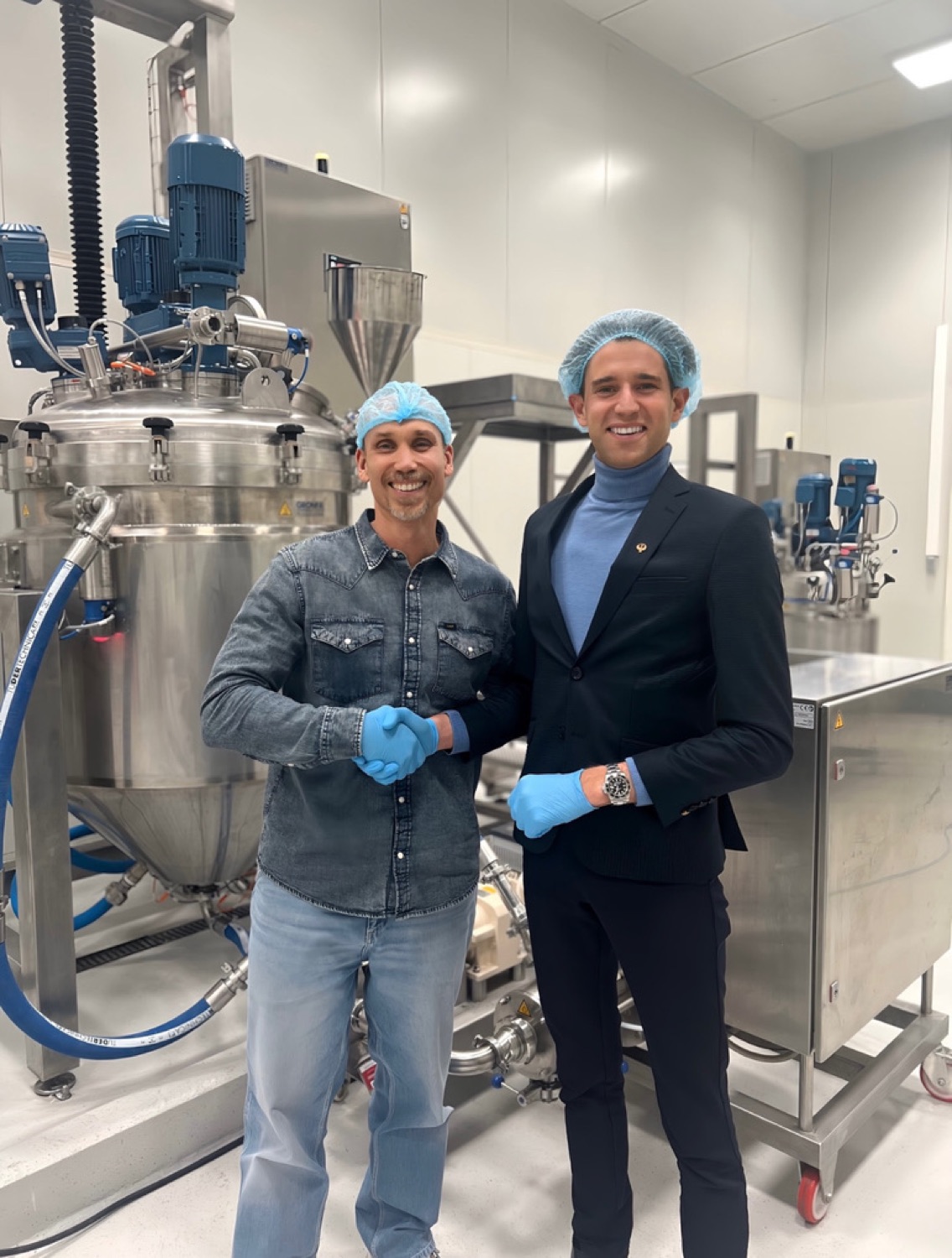 Robin Rouquart with the plant manager at the mixing tanks